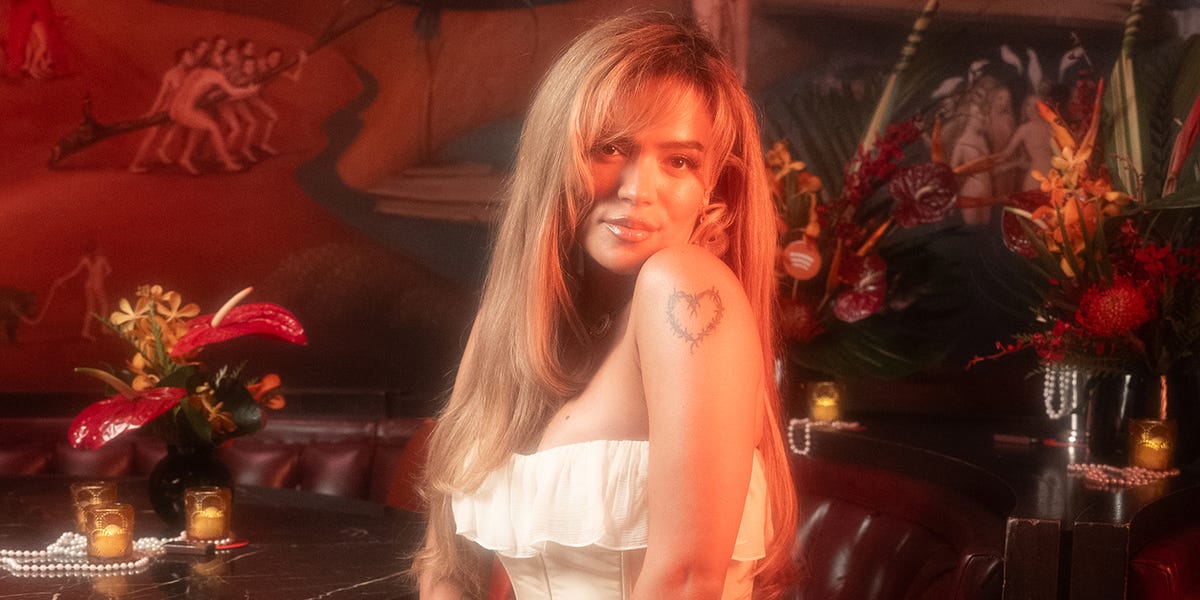 Karol G Channels Quinceañera Style In Ruffled Ivory Dress