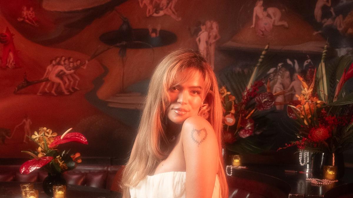 Singer Karol G Reimagines Quinceañera Style With Elegant Ivory Gown